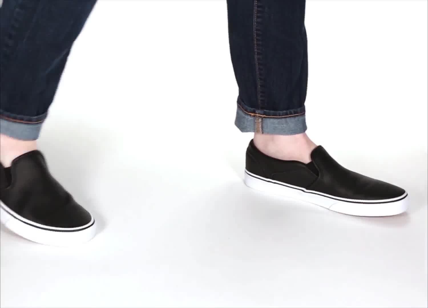 black perforated slip on sneakers