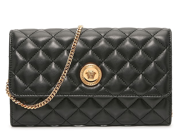 Quilted satin clutch bag with shoulder strap