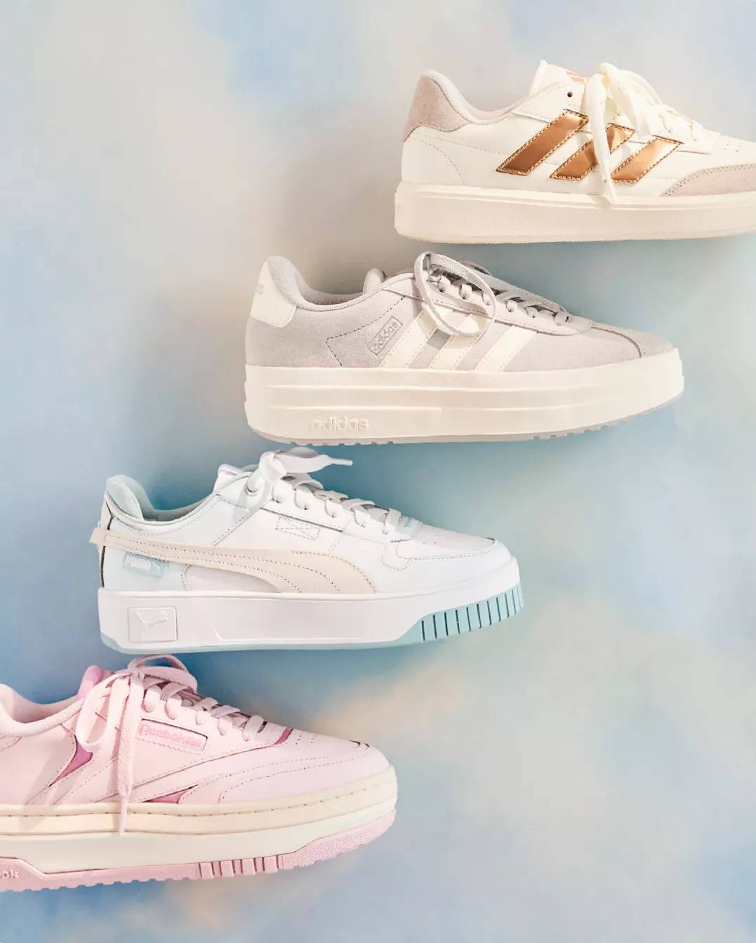 Four sneakers on a cloud background