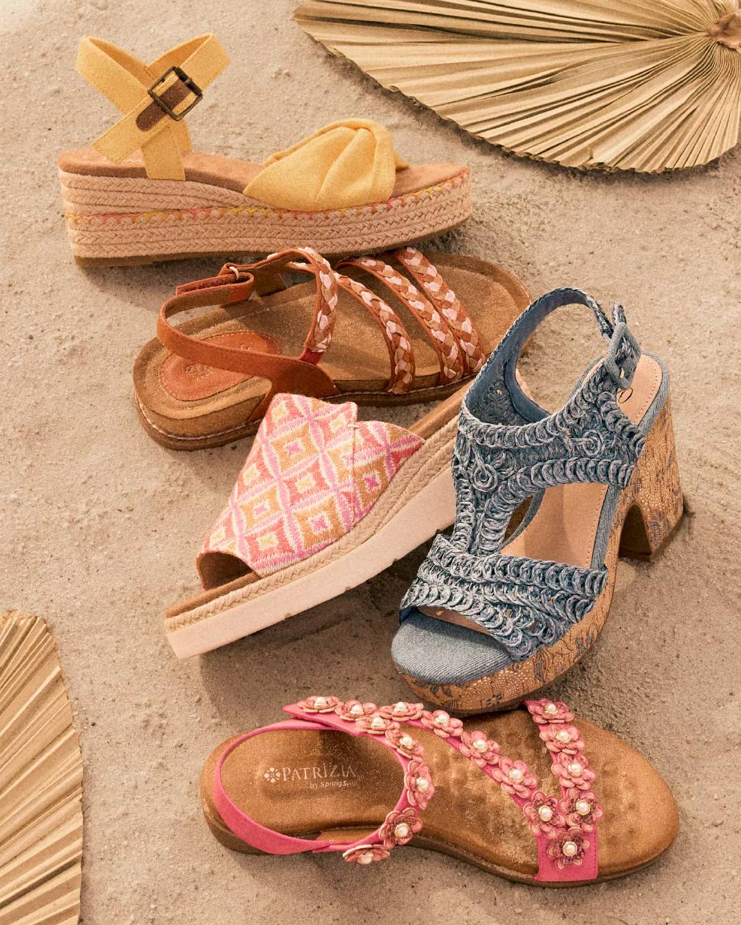Five sandals in the sand