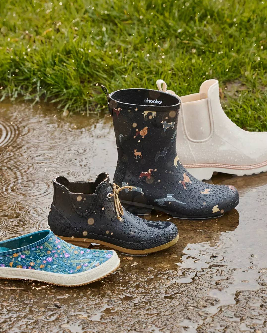 Four boots in a line in the rain outside