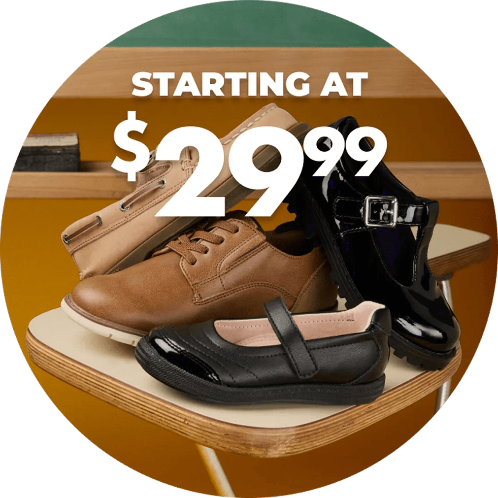 Featuring an assortment of full family uniform shoes in a classroom.
